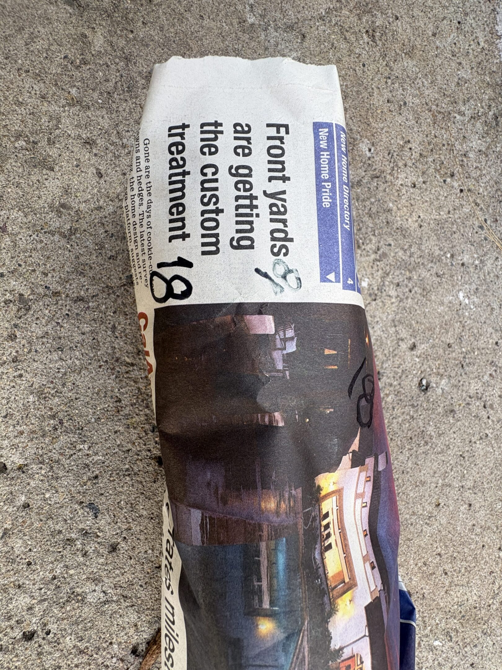 A rolled-up magazine with a visible headline about drug treatment.