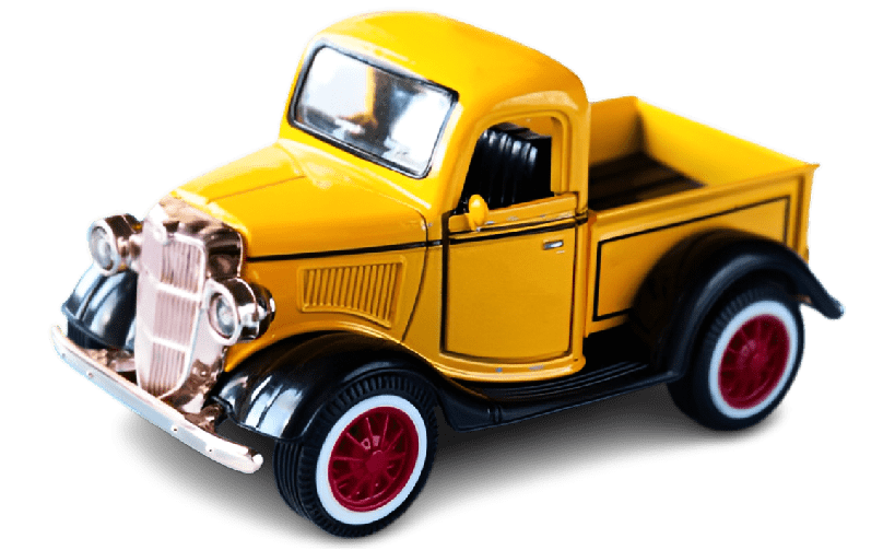 Yellow vintage toy truck on black background.