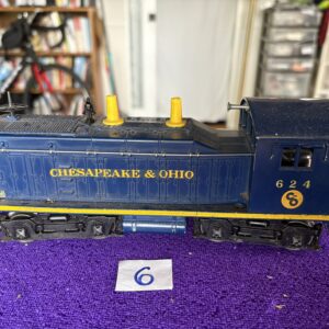 Vintage Chesapeake & Ohio model train engine with yellow details.