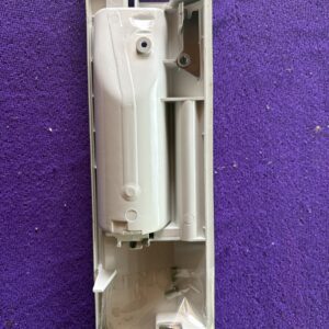 Inside view of a disassembled white electronic device component.