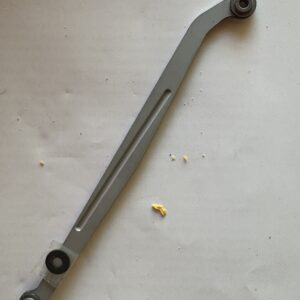 Metal automotive control arm with bushings on both ends.