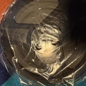 Close-up of a liquid splash creating ripples inside a container.