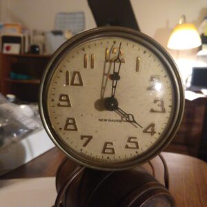 Close-up of a vintage clock showing time 3:00.