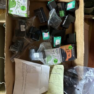 A box filled with various small electronic components and packets.