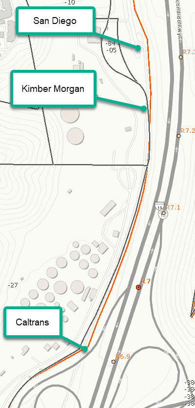 Topographic map showing contour lines and structures near a road.